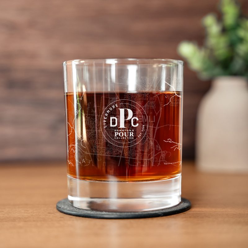 Etched rocks glass showing the Downtown Pour Collective mark